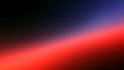A bright crimson glow sweeps diagonally up from the lower left into deep indigo.