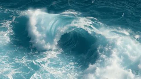 A cyan wave rolls over into a hollow barrel, with churning white water spreading out around it.
