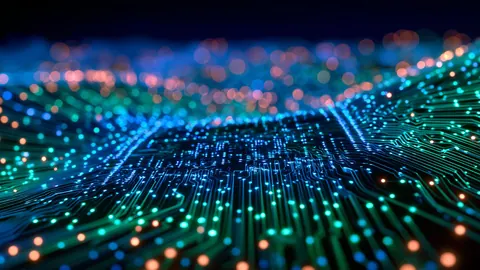 Macro circuit traces glow orange and green across a shallow-focus board.