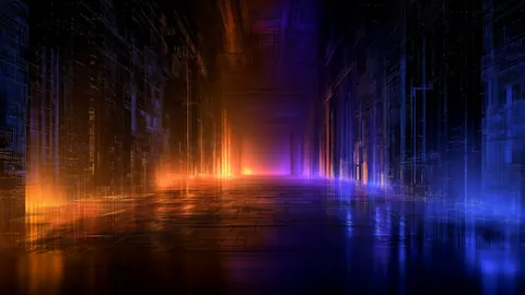 Tall columns of data light glow orange and violet over a reflective floor, like a corridor inside a machine.