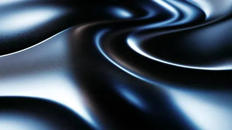 Liquid metal bends in smooth, glossy waves, reflecting streaks of white and cool blue.