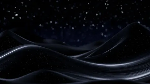 Smooth black waves roll beneath a dark sky sprinkled with tiny lights.