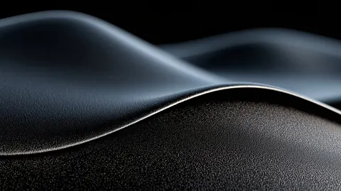 Desktop wallpaper of a dark sand dune with a soft silver crest.