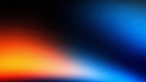 Warm tangerine light from the left meets bright cobalt blue on the right.