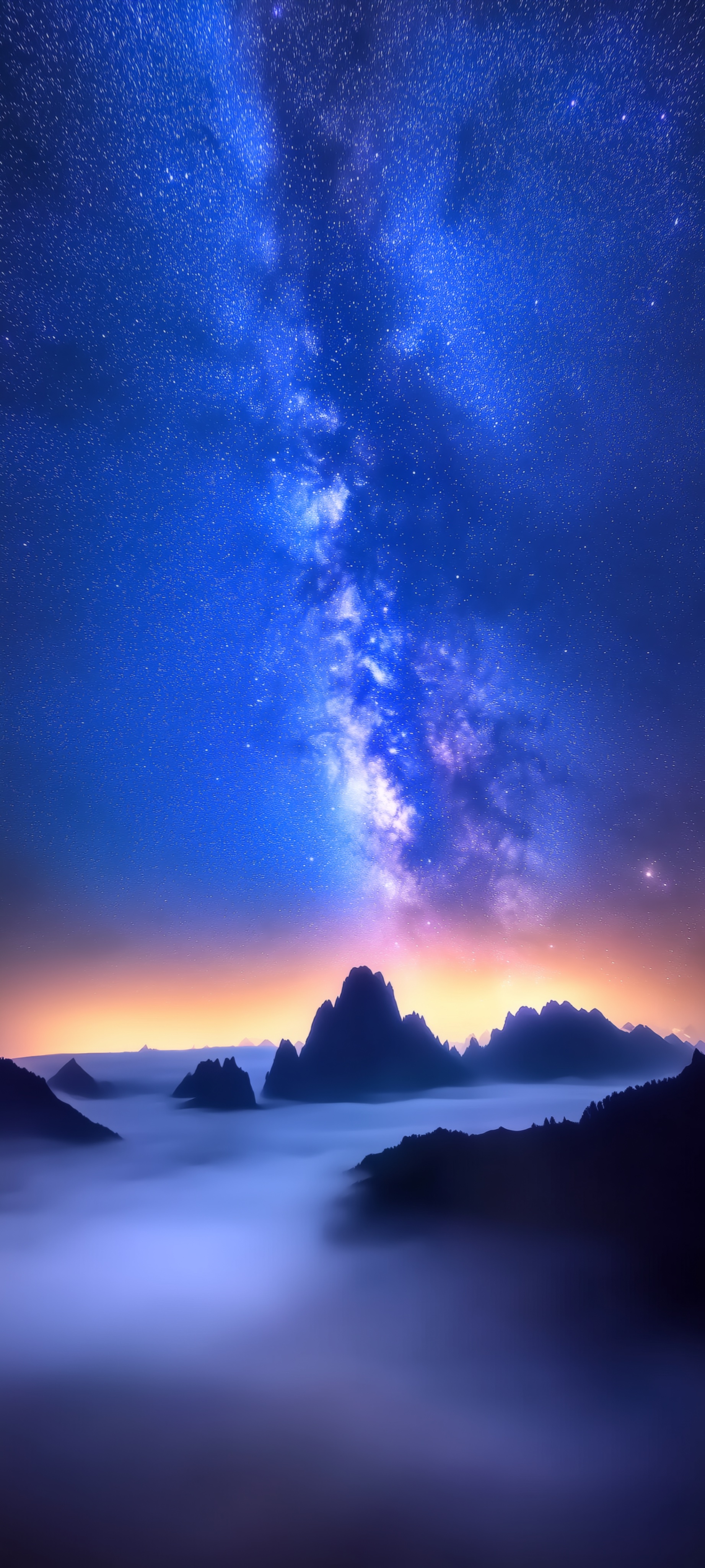Phone wallpaper of the Milky Way rising over jagged mountain peaks, with a glowing orange horizon and a sea of fog below