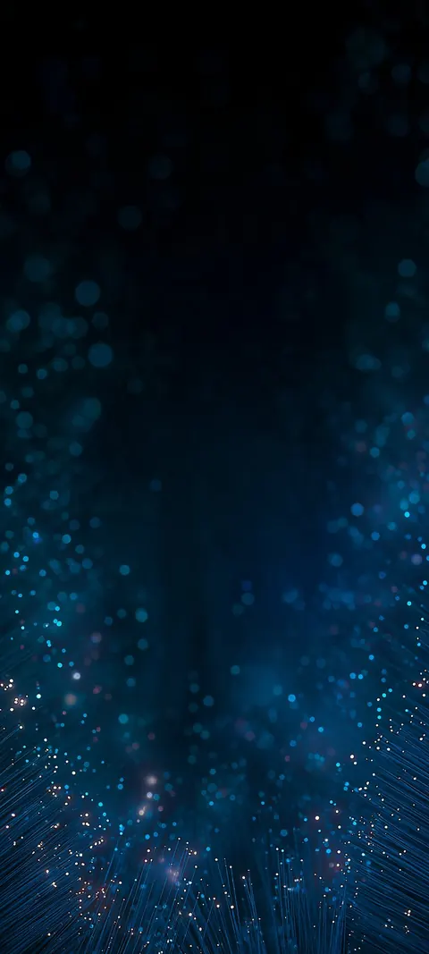 A dense field of teal particles rises from a shimmering base into the dark.