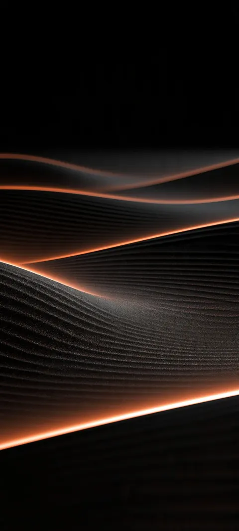 Dark undulating ridges edged in a thin line of glowing orange light.