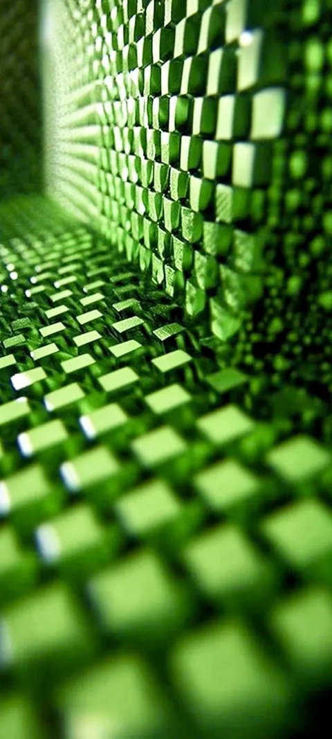 A tight grid of tiny emerald cubes turns a corner like a keycap corridor, sharp in the middle and soft at the edges.