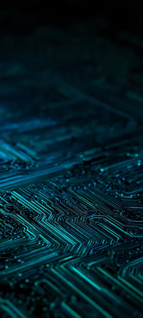 A macro circuit board in deep greens and teals, every trace lit like a tiny constellation.