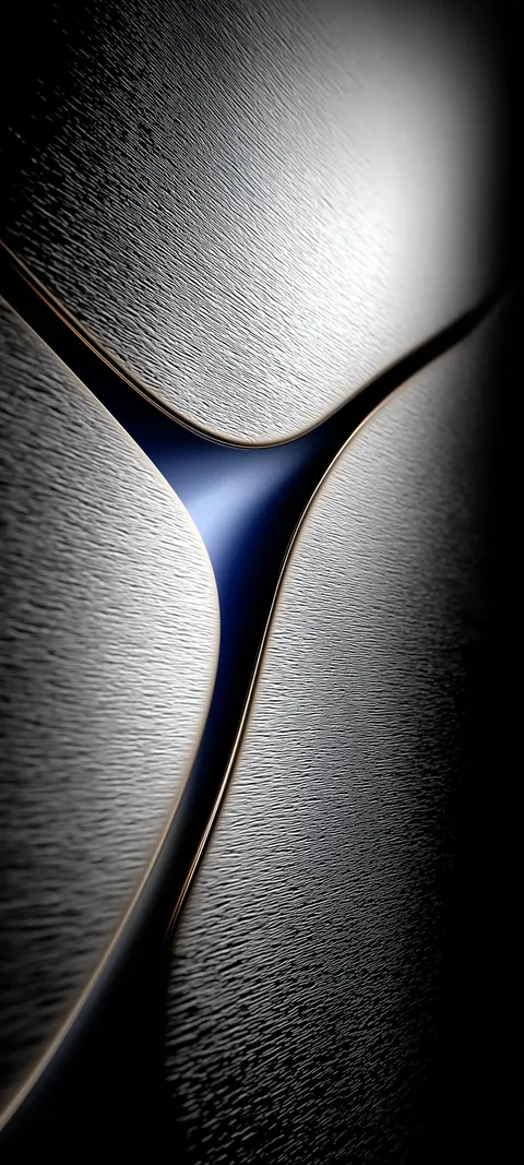 Brushed graphite-gray shapes meet in a soft curve, edged with a thin copper line around a dark blue center.